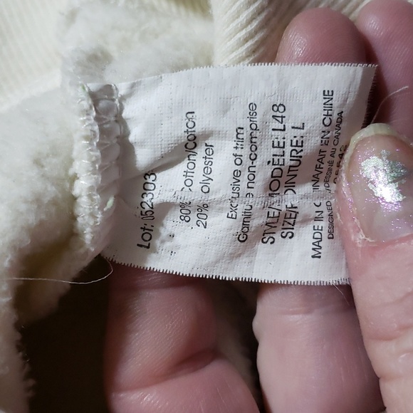 Attraction zip up jacket says Canada in front. Cream in color size lg - Picture 9 of 9